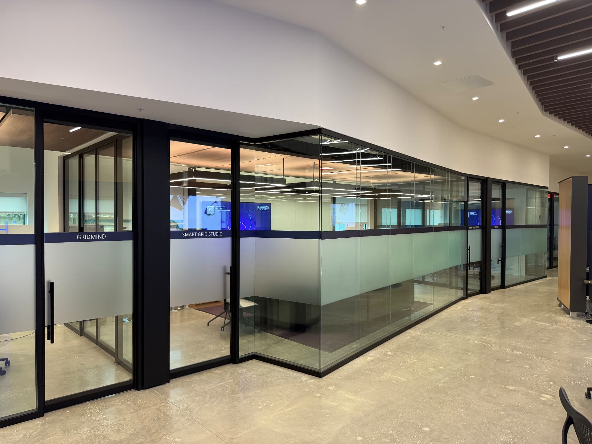 Modern office glass partitions with frosted privacy film